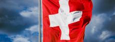 Swiss flag with sky background